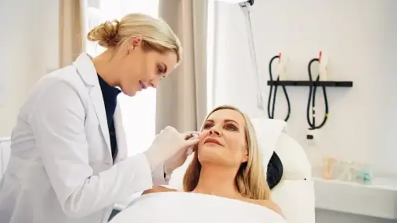Plastic surgeon analysisng womens skin